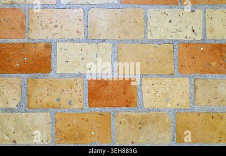 Floor texture made of mixed terracotta bricks. Rustic tiles for outdoor patio. Background. Full frame. Stock Photo