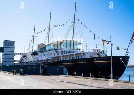 Royal Yacht Britannia, former royal yacht of the British Monarchy, now a tourist attraction docked at Ocean Terminal in Leith, Edinburgh, Scotland, UK Stock Photo