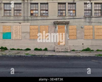 A vacant building stands boarded up on West Toronto Street in North Philadelphia's Swampoodle neighborhood. Stock Photo