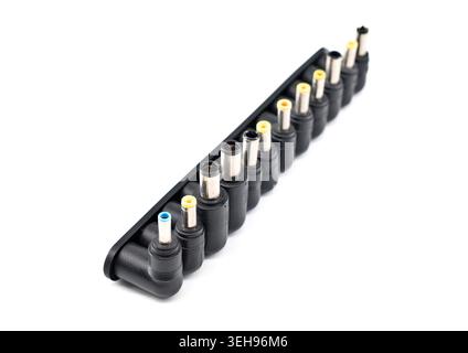 Set of universal adapter power supply plugs for laptop and notebook on white background Stock Photo