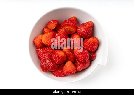 Fresh Red Strawberries in Bowl on White Background Top View Stock Photo