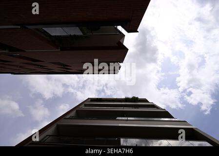 Looking up through houses. Houses at Hamburg harbor. Looking up in the sky. Stock Photo