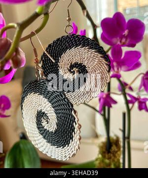 Handwoven black and white spiral earrings Stock Photo
