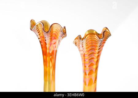 Carnival Glass vases a iridescent glassware in marigold orange colour Stock Photo