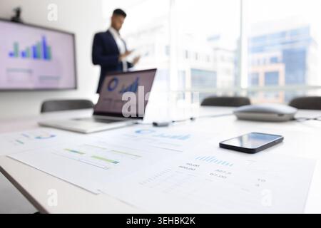 Printed financial charts and graphs placed on conference table, closeup Stock Photo