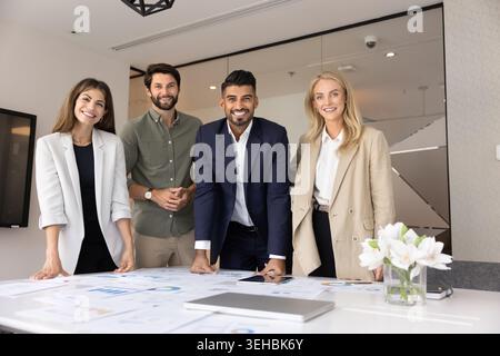 Business team engaged in briefing or meeting in modern office Stock Photo