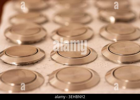 Pattern Of Stainless Steel Push Buttons In Protective Foam Stock Photo