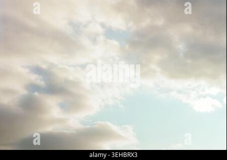 Soft Cloudy Sky Background with Pale Blue Light Stock Photo