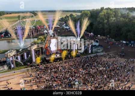 Herzogenaurach, Germany - 27 July 2025: Aerial view of the Open Beatz Festival featuring a massive main stage with pyrotechnics, a Ferris wheel, and a Stock Photo