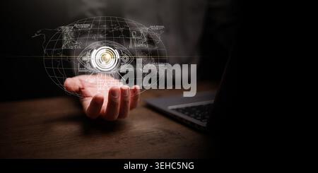 Hand holding glowing AI surveillance eye over world map on dark copy space. Global monitoring, facial recognition, cybersecurity, privacy risk, tracki Stock Photo