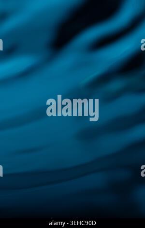 297.Abstract close-up of flowing lines in blue and black tones. Smooth wave-like patterns suggest fluid motion. Gradient shading creates depth and dyn Stock Photo