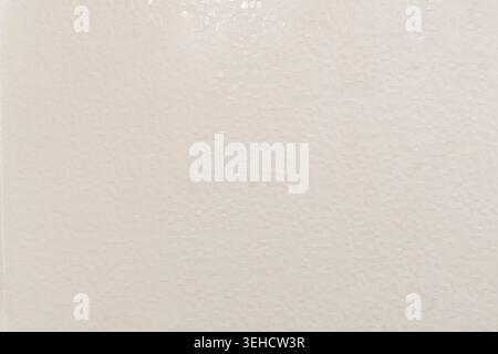 beige ceramic tile wall or floor with seamless pattern is used as ceramic background texture in decorative art work. Stock Photo