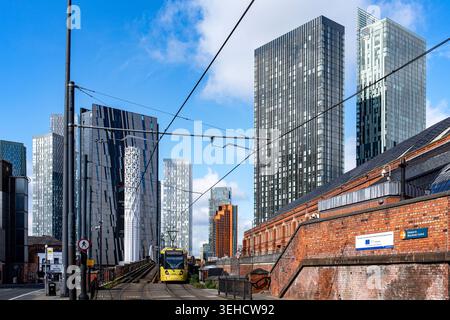 Tram at Deansgate Castlefield with Tower of Light, Deansgate Square, Manchester UK Stock Photo