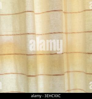Brown curtain or drape background texture with wave pattern is used as background texture in decorative art work. Stock Photo