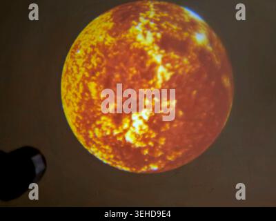 a projection of the Sun, displaying its highly active, mottled surface covered in solar plasma, flares, and sunspots Stock Photo