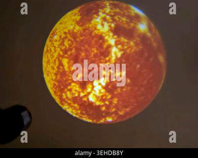 a projection of the Sun, displaying its highly active, mottled surface covered in solar plasma, flares, and sunspots Stock Photo