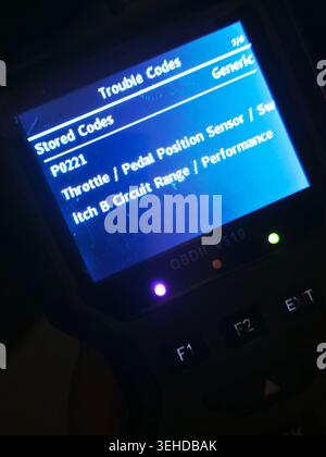 Cairo, Egypt, May 17 2026: Code P0221 error on OBD2 diagnostic scanner, displaying a trouble code related to the vehicle's throttle or pedal position Stock Photo