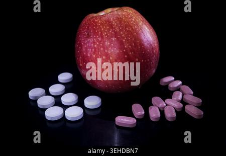 An apple a day keeps the doctor and medicine away Stock Photo