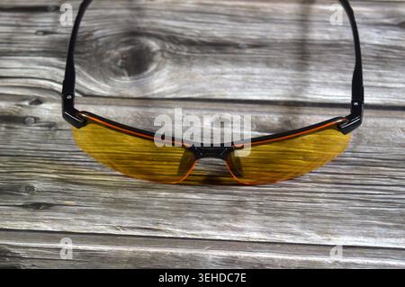 polarized night driving glasses with yellow lenses designed to reduce glare from headlights and streetlights, a yellow night driving glasses Stock Photo