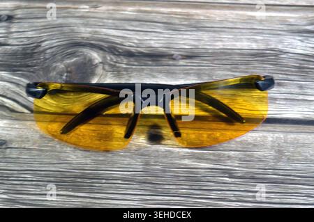 polarized night driving glasses with yellow lenses designed to reduce glare from headlights and streetlights, a yellow night driving glasses Stock Photo