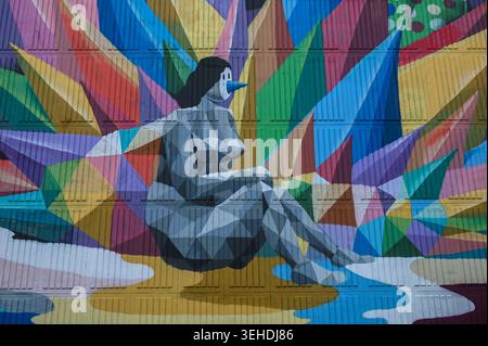 Toronto, ON, Canada - March 14, 2026: Striking mural featuring a stylized figure with vibrant, geometric shapes against a textured wall. Stock Photo