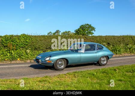 1966 60s sixties British Silver Jaguar 'E' Type 265 XK I6 Car Coupe Petrol 4235 cc,  XK inline-6 engine, two-seater fastback coupe. Stock Photo