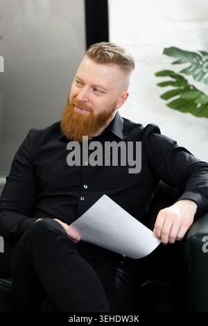Confident businessman with beard during corporate discussion in office Stock Photo