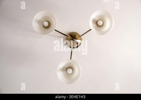 ceiling chandelier with three shades, bottom view Stock Photo