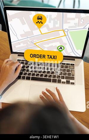 User places order for taxi on a map displayed on a laptop in a busy area Stock Photo