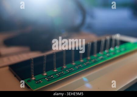 Intricate electronic circuit board component viewed in macro highlighting advanced technology engineering prototype connector hardware with fascinatin Stock Photo