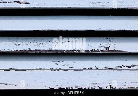 Close-Up of Weathered Wooden Slats with Peeling White Texture Stock Photo