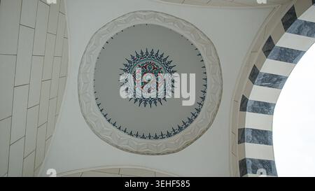 ISTANBUL, Türkiye - April 30, 2026.The view shows the detailed ceiling art of a mosque with an eight pointed star design in the center. Stock Photo