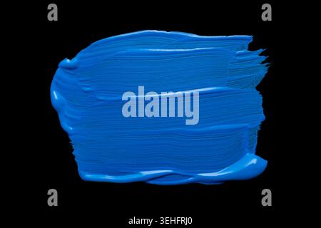Blue abstract oil paint spot. Blue oil paint brush stroke on black background Stock Photo