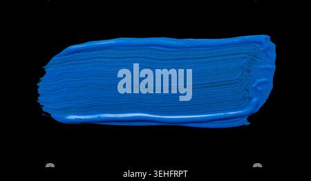 Blue abstract oil paint spot. Blue oil paint brush stroke on black background Stock Photo