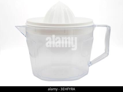 A clean, white plastic measuring jug with a pouring spout and handle, isolated on a plain white background, showing volume markings. Stock Photo