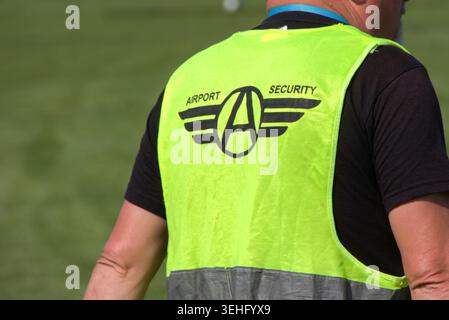 Rear view of a Airport Security Guard Stock Photo
