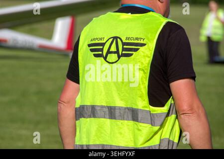 Rear view of a Airport Security Guard Stock Photo