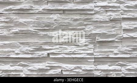 White layered stone wall texture close up Stock Photo