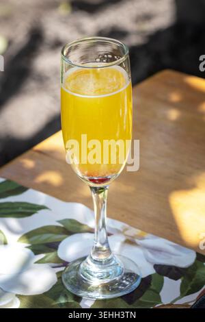Sparkling tropical mimosa cocktail served outdoors in elegant brunch setting Stock Photo