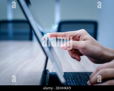 User scanning fingerprint on laptop for biometric verification. Secure access, identity confirmation, authentication technology, cybersecurity protect Stock Photo