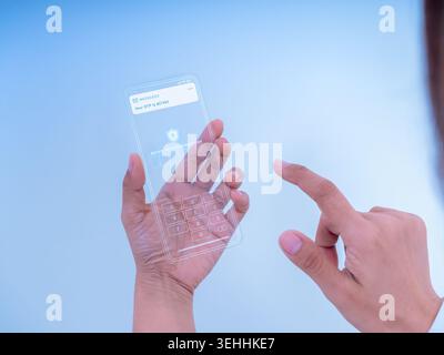 User entering OTP code on futuristic transparent smartphone interface. Two factor authentication, secure login verification, digital identity protecti Stock Photo