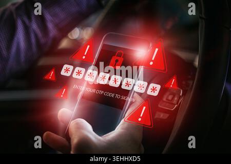 Scam message appears on phone while someone is in a vehicle at night Stock Photo