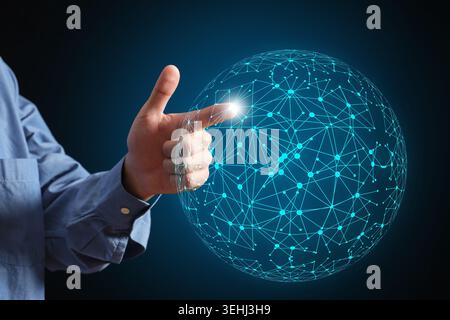 Hand of a person interacting with a digital globe, symbolizing worldwide connection, communication, and technological innovation Stock Photo