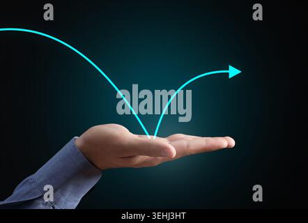 Helping hand supporting a bouncing arrow, symbolizing business recovery, market rebound and sustained economic growth Stock Photo
