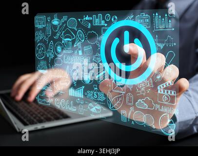 Person's hand pressing a start button on a transparent touch screen displaying various business doodles and concepts. Business startup concept. Stock Photo