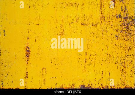 Rusty yellow metal steel plate as texture or background Stock Photo