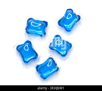 Blue laundry detergent pods or  washing gel capsules isolated on white, top view Stock Photo