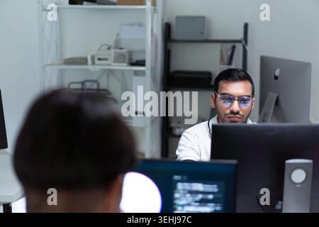 Modern Tech Startup Office With Software Developers Working At Computers Stock Photo