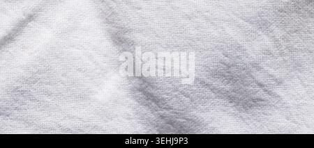 White knitted fabric texture with natural gray shadow stain marks Stock Photo