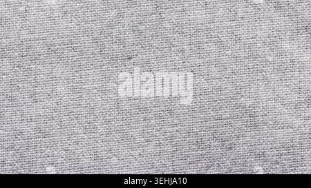 Natural gray linen fabric texture close up showing woven cotton threads for textile background Stock Photo